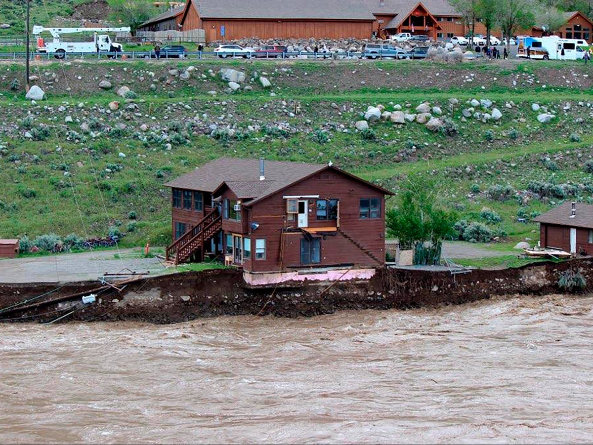 Video shows large home slipping into river and floating away amid historic Yellowstone flooding