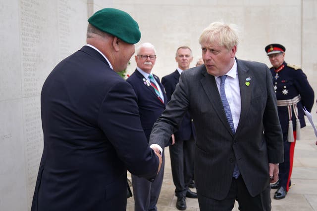 Prime Minister Boris Johnson meets veterans at the National Memorial Arboretum before a service to mark the 40th anniversary of the liberation of the Falkland Islands. (Jacob King/PA)