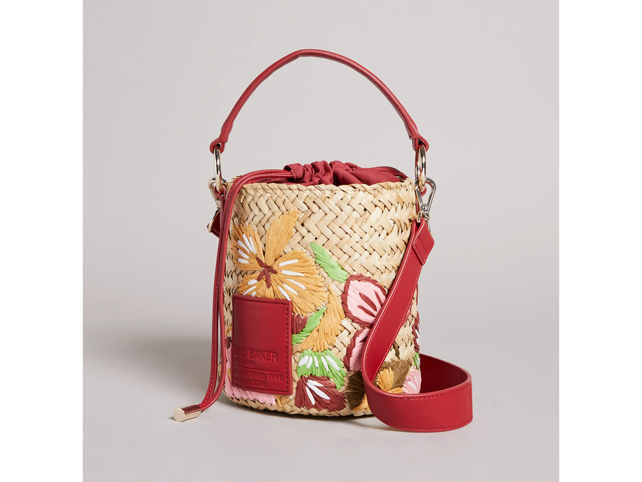 Ted Baker Appita appleseed embroidered straw bucket.png