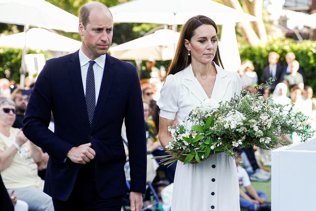 <p>Prince William and Kate, the Duchess of Cambridge, lay a wreath at the base of Grenfell Tower at a memorial service in June 2022 </p>