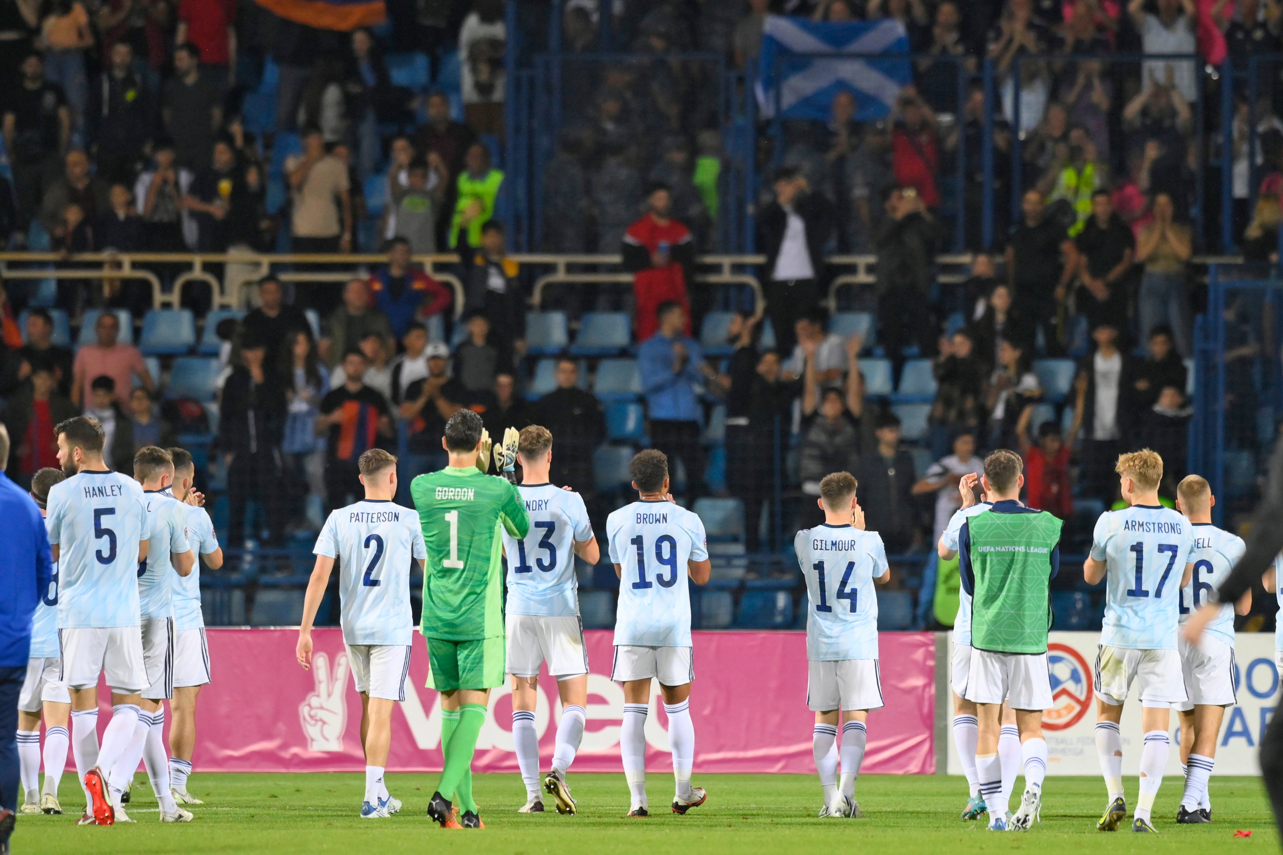 Scotland players applaud their fans in Yerevan (Hakob Berberyan/AP)