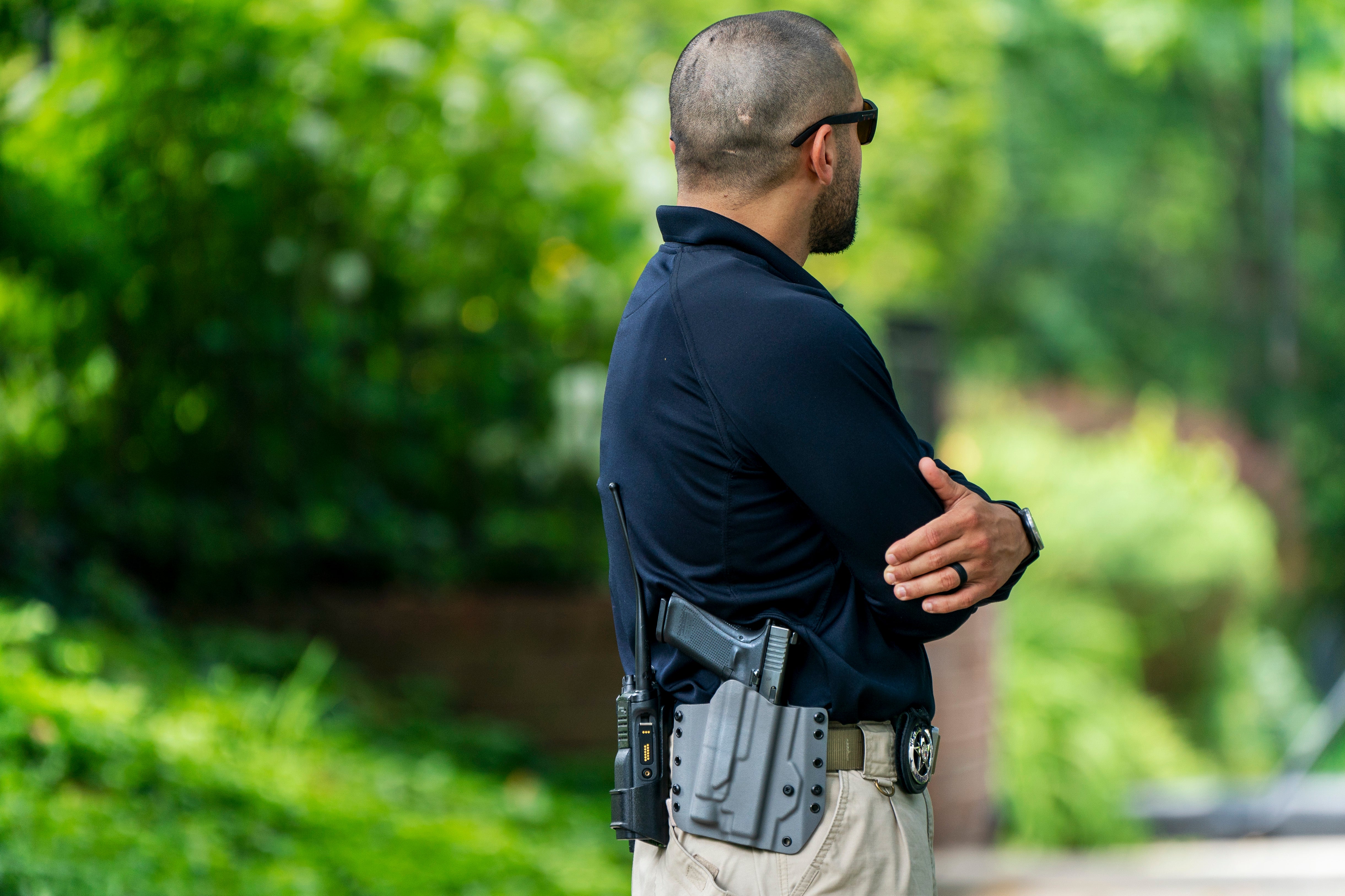 A US Marshal outside the home of Justice Brett Kavanaugh