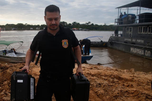 <p>Federal police officers arrive at the pier after searching for Indigenous expert Bruno Pereira and freelance British journalist Dom Phillips in Atalaia do Norte, Amazonas state, Brazil,</p>