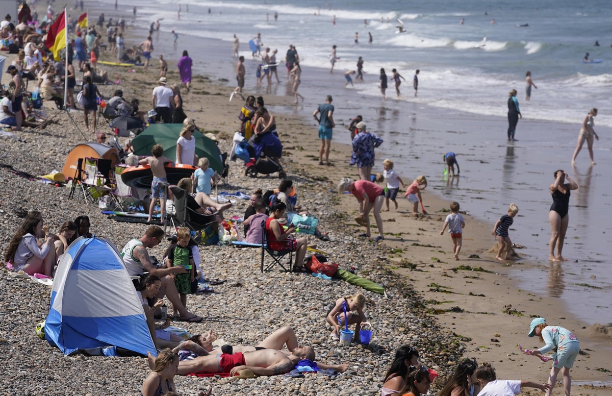Weather forecast – latest: Britons swelter on hottest day of year, says Met Office