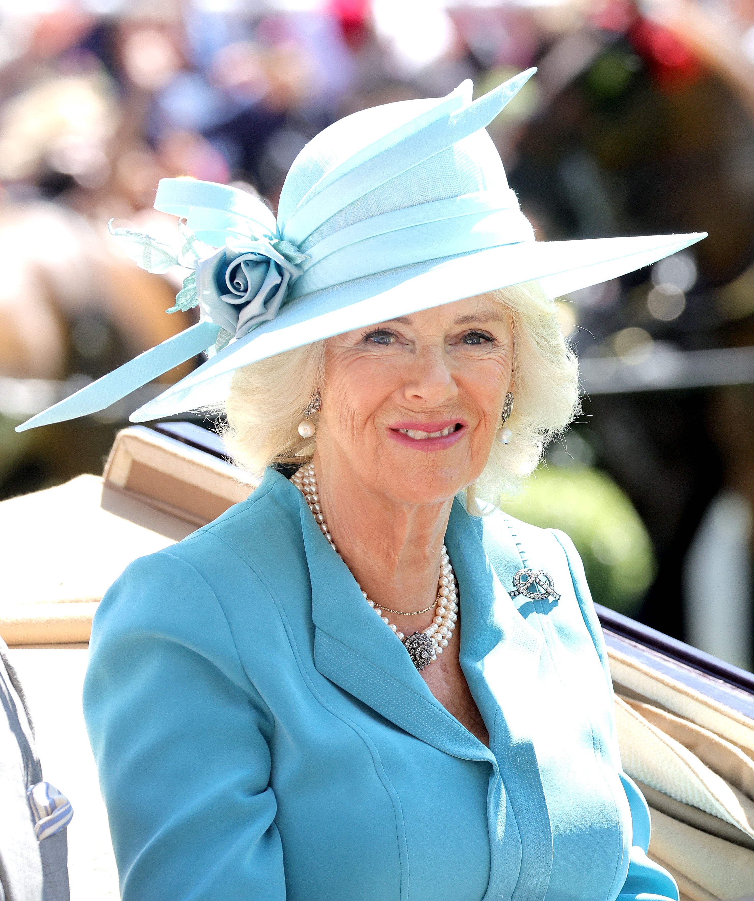 Camilla, Duchess of Cornwall arrives into the parade ring in the royal carriage as she attends Royal Ascot 2022