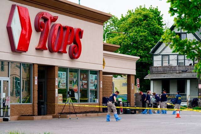 <p>Investigators on the scene at the Tops Friendly Market in Buffalo following the 14 May massacre </p>