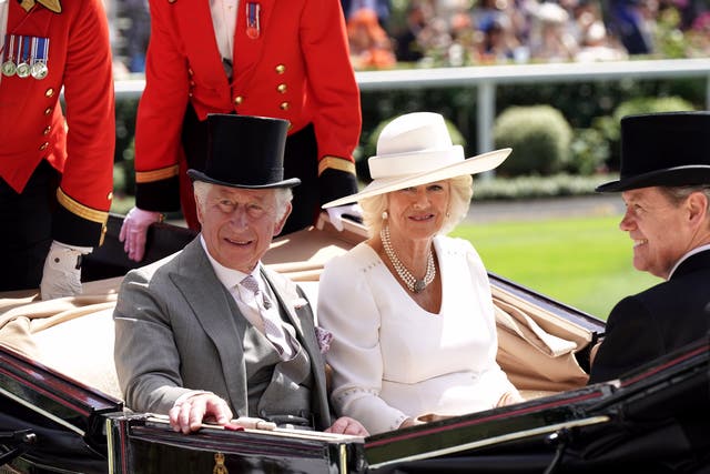 The Prince of Wales and the Duchess of Cornwall in the royal procession (PA)