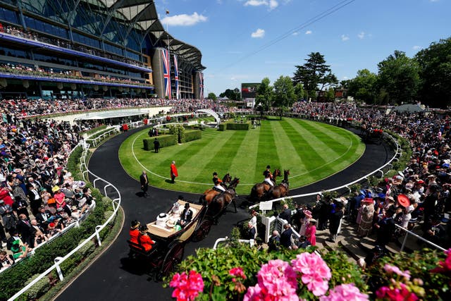 <p>The royal procession arrives into the parade ring ahead of racing on day two of Royal Ascot</p>