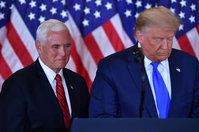 <p>In this file photo taken on November 04, 2020, US President Donald Trump and US Vice President Mike Pence speak during election night in the East Room of the White House in Washington, DC</p>