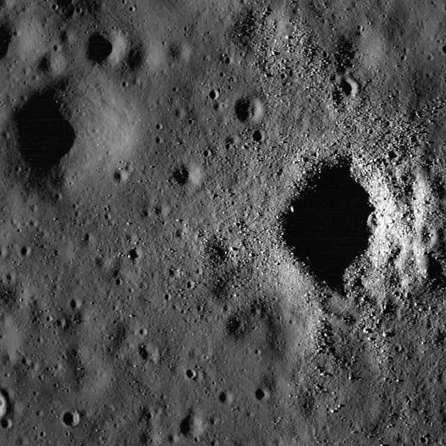 <p>A crater in the “Sea of Storms” on the Moon</p>