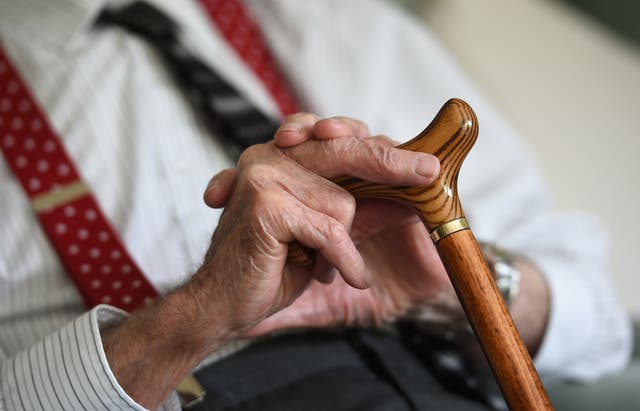 An elderly man holding a walking stick (Joe Giddens/PA)