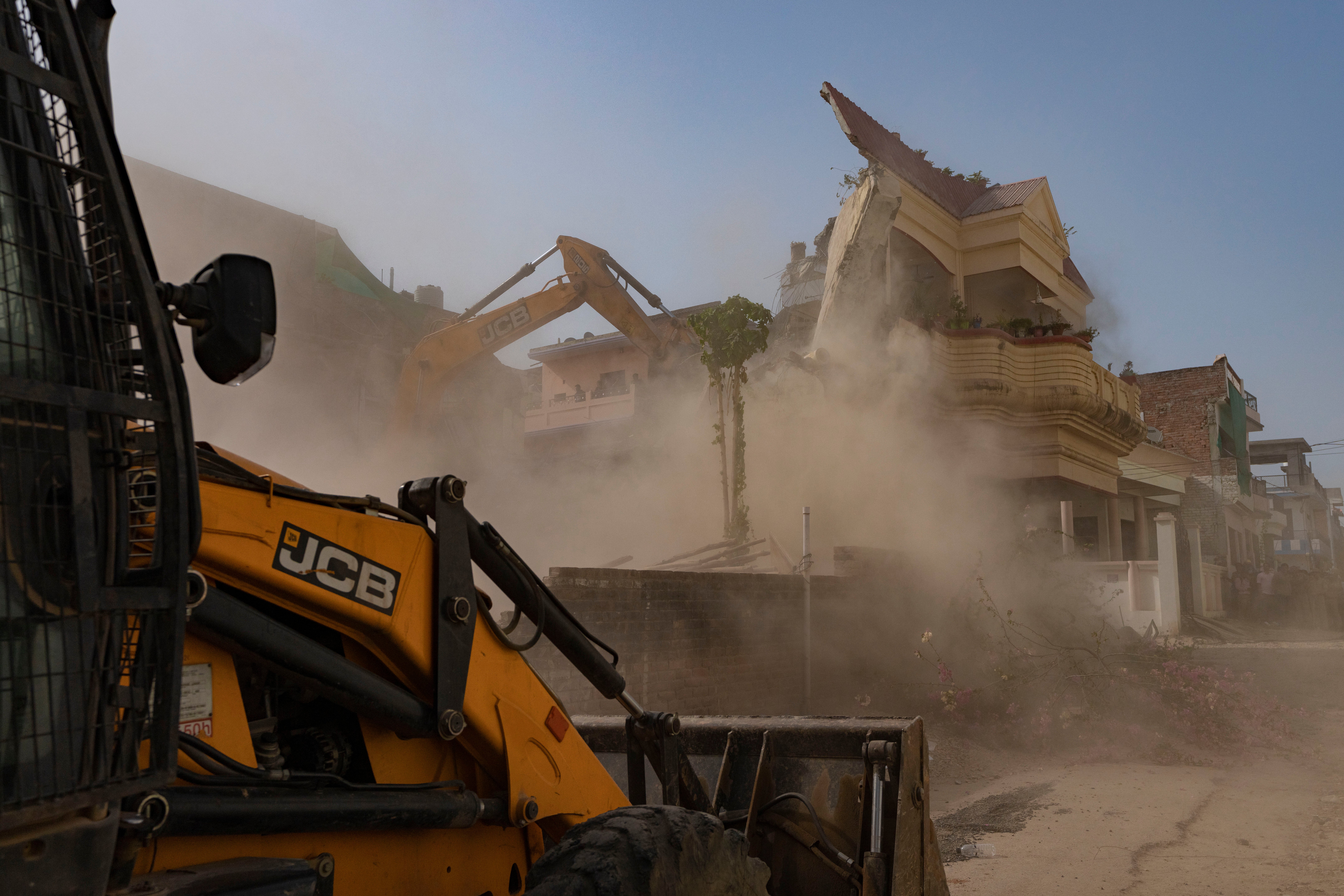 Authorities demolish the residence of activist Javed Mohammad on 12 June
