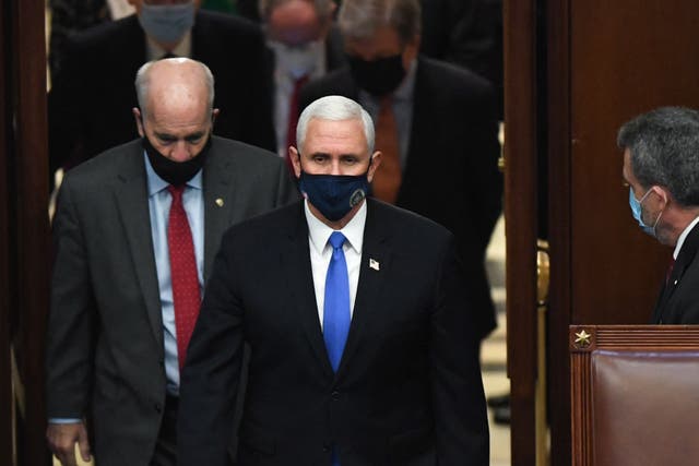 <p>Mike Pence arrives to preside over the 6 January 2021 electoral certification session in Congress</p>