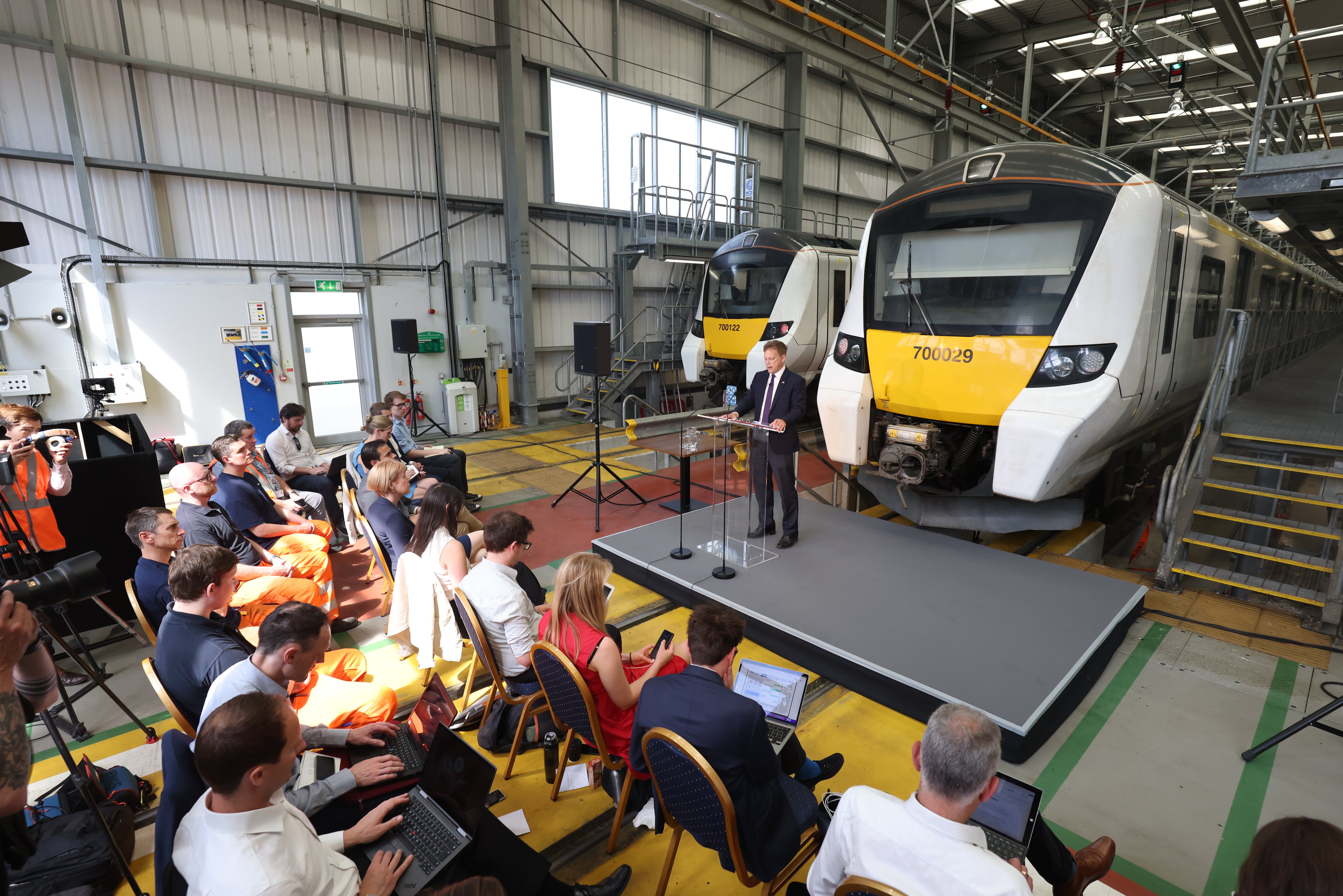 Grant Shapps was speaking at a train depot in north London (PA)