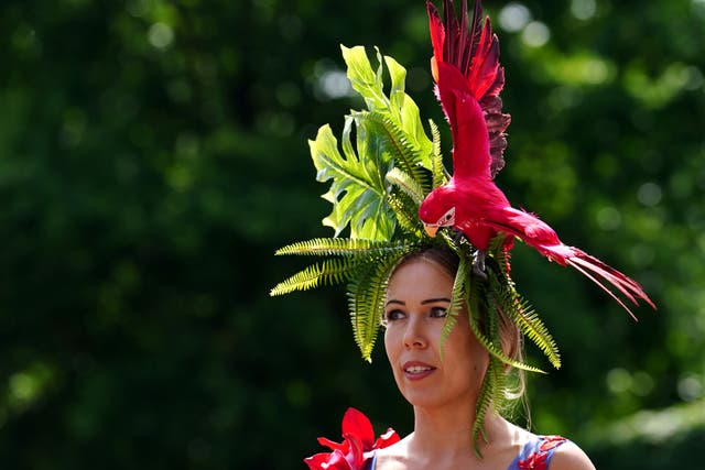 A racegoer wearing a parrot-themed hat during day three of Royal Ascot at Ascot Racecourse. Picture date: Thursday June 16, 2022.