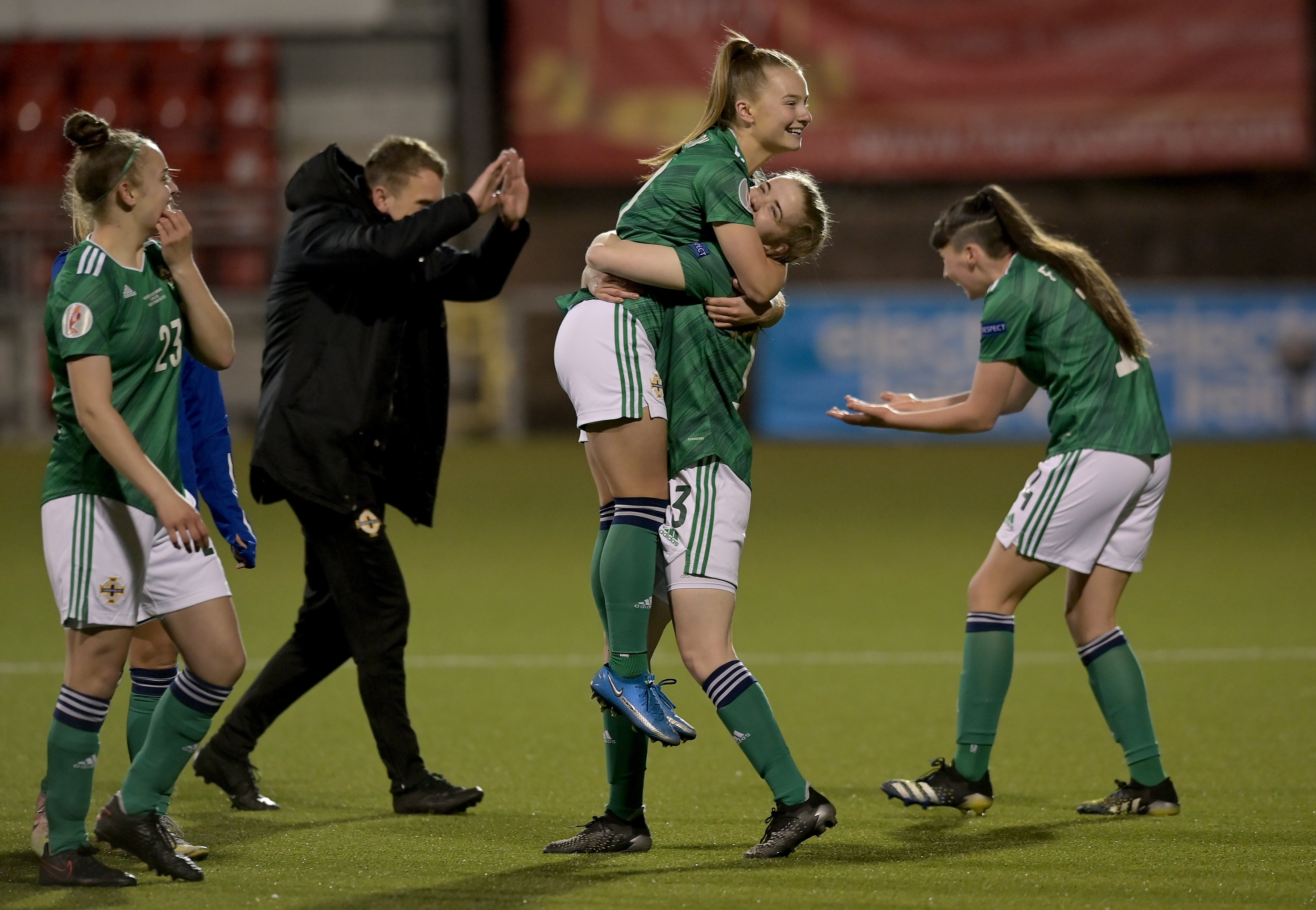 Emily Wilson and Emma McMaster of Northern Ireland celebrate victory over Ukraine in April 2021