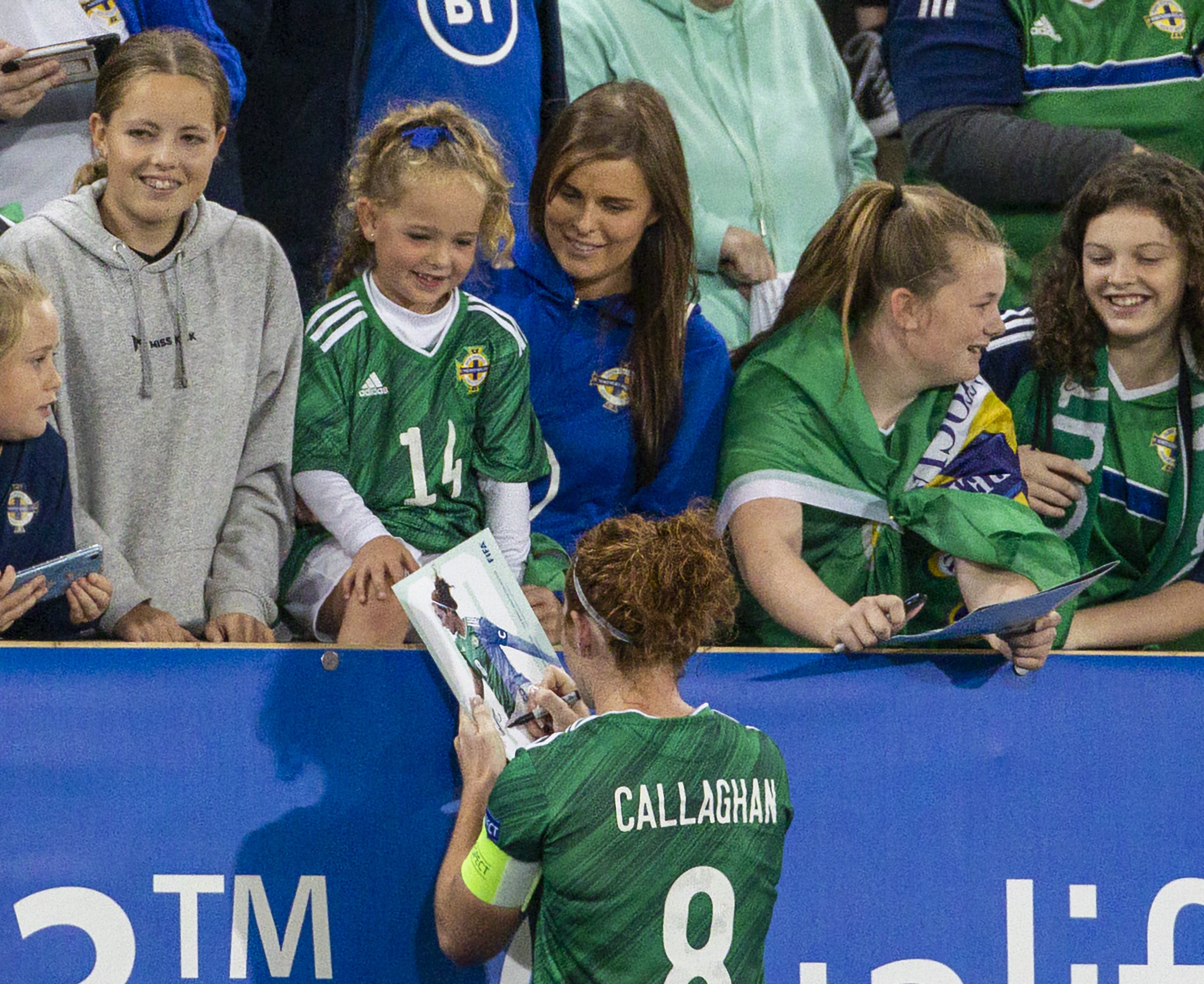 Marissa Callaghan signs a football programme for a fan after a Fifa Women's World Cup qualifying match in Belfast