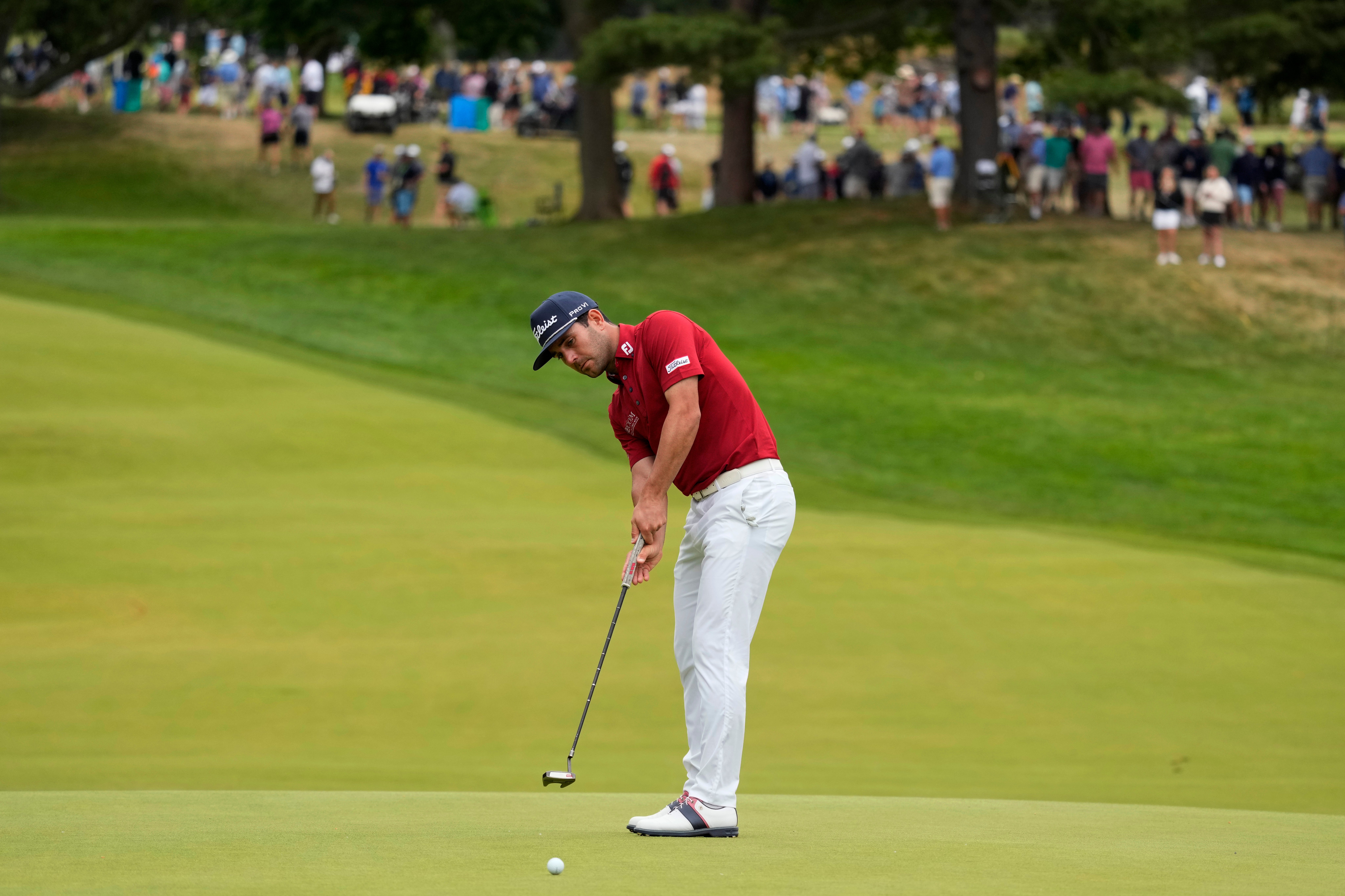 Callum Tarren putts on the ninth hole during the first round of the US Open (Charlie Riedel/AP)
