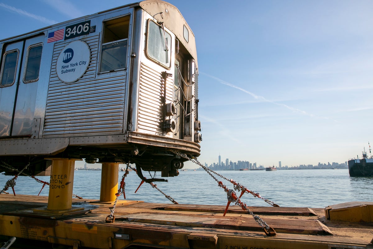 Bon voyage: Old subway cars float off across New York Harbor