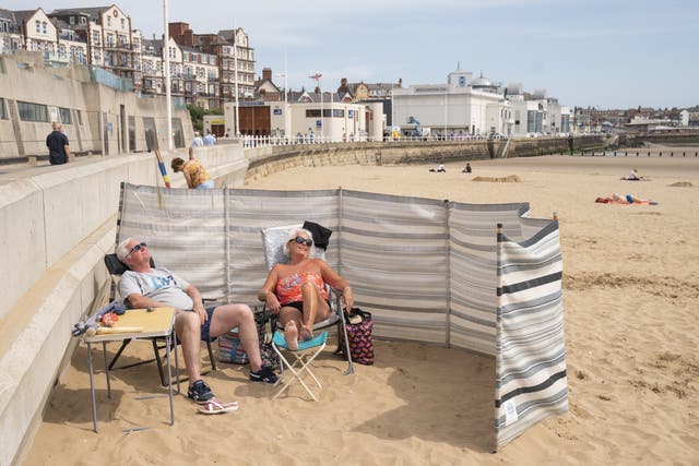 People sunbathe as they enjoy the hot weather on Bridlington beach in Yorkshire. Picture date: Thursday June 16, 2022.