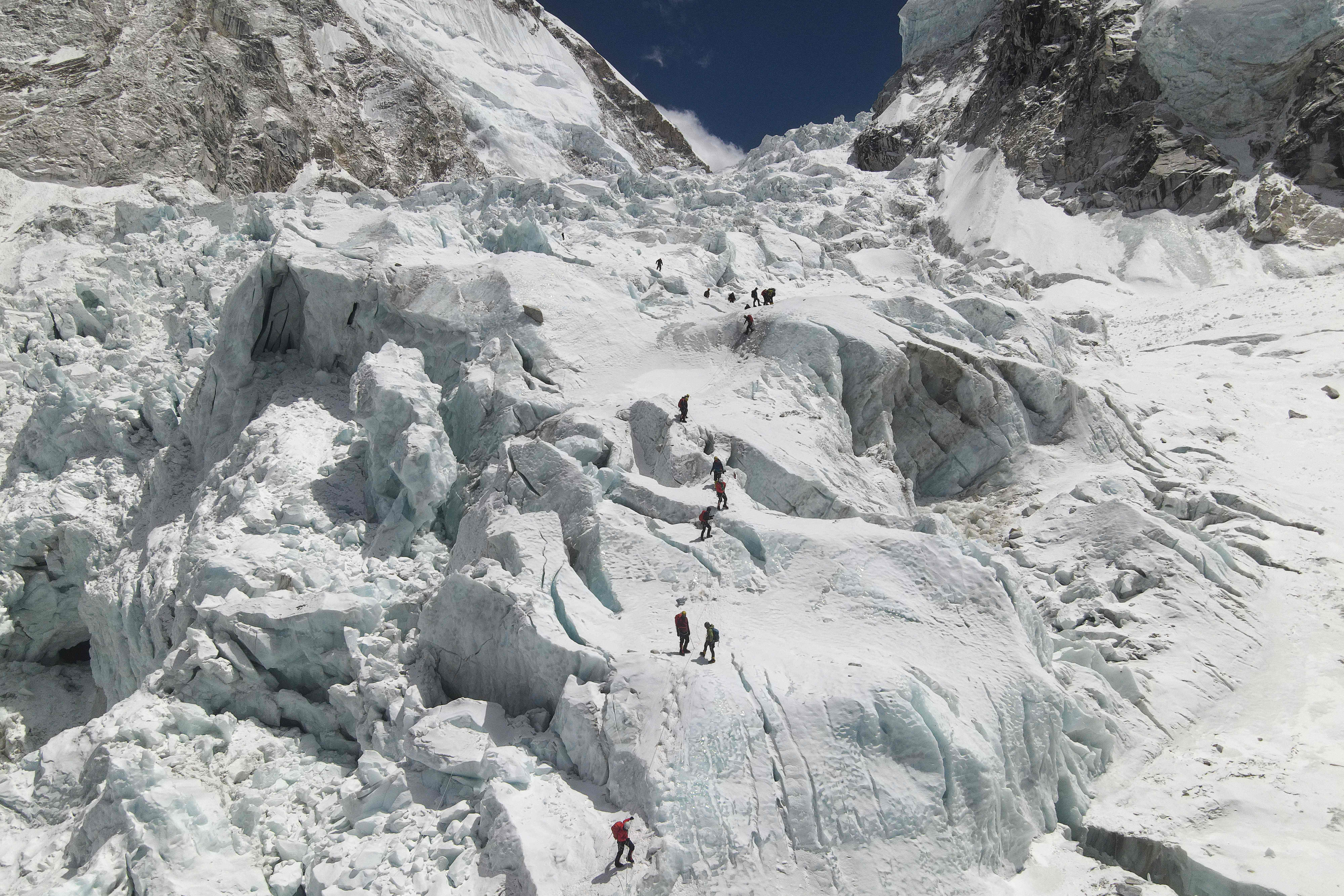 Climbers crossing the Khumbu icefall of Everest, as seen from base camp, 140km northeast of Kathmandu