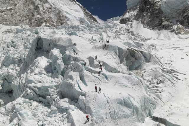 <p>Climbers crossing the Khumbu icefall of Everest, as seen from base camp,  140km northeast of Kathmandu</p>