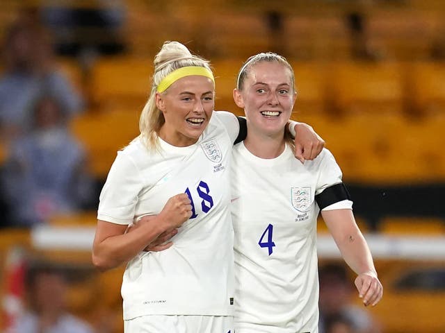 <p>Chloe Kelly (left) celebrates after England’s opener on Wednesday</p>