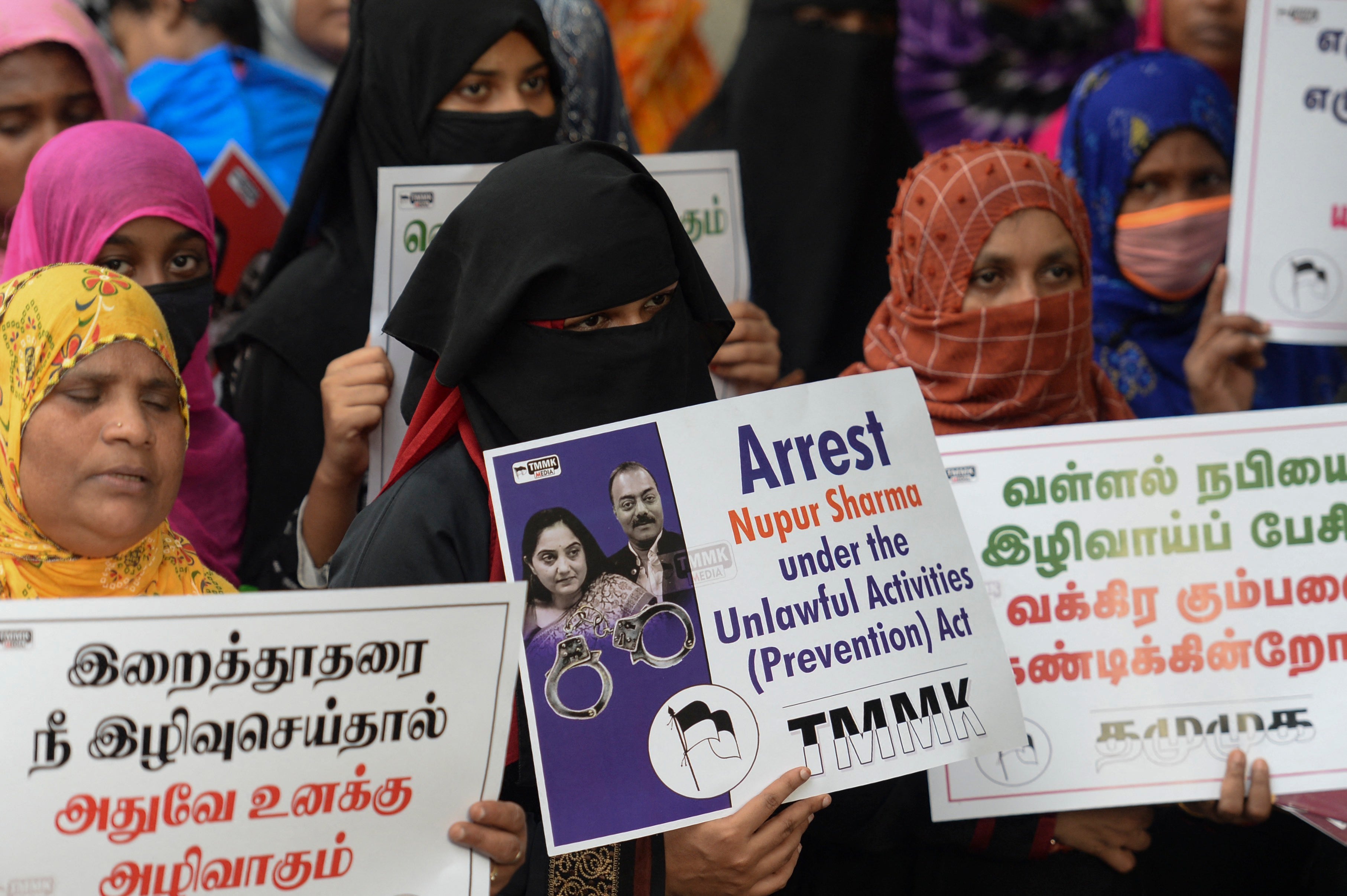 Muslim activists hold placards during a protest calling for the arrest of former BJP spokesperson Nupur Sharma in Chennai