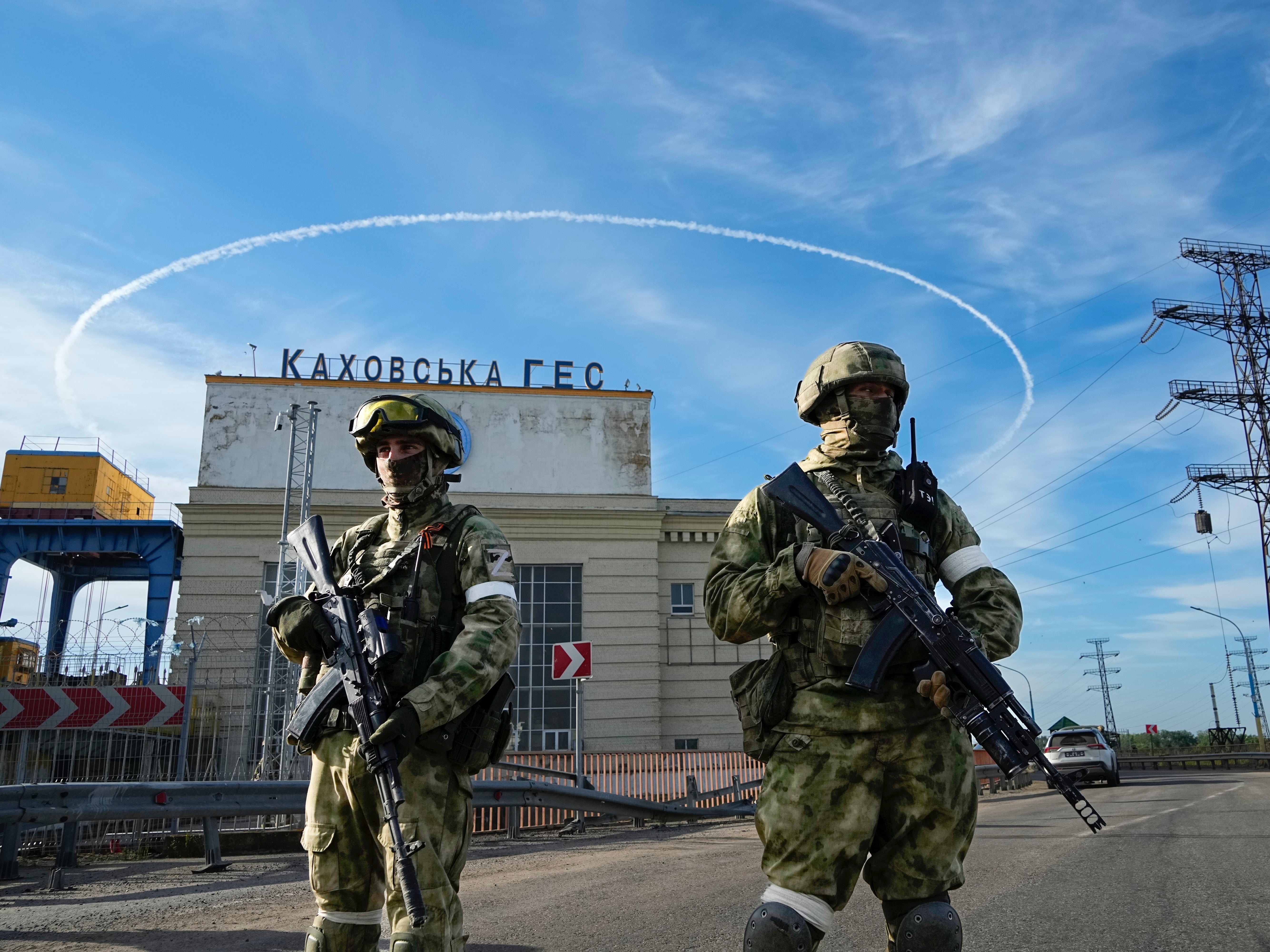 Russian army troops guard a power plant in the Kherson region