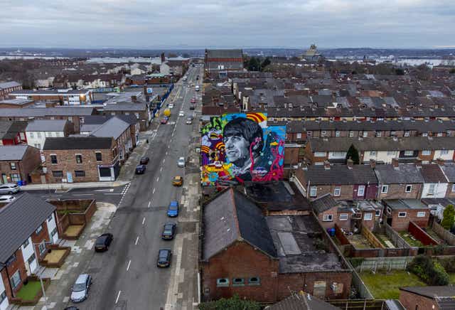 A mural of Ringo Starr, commissioned by Liverpool artist John Culshaw, is unveiled on the gable end of the Empress Pub on Admiral Street in Liverpool (Peter Byrne/PA)