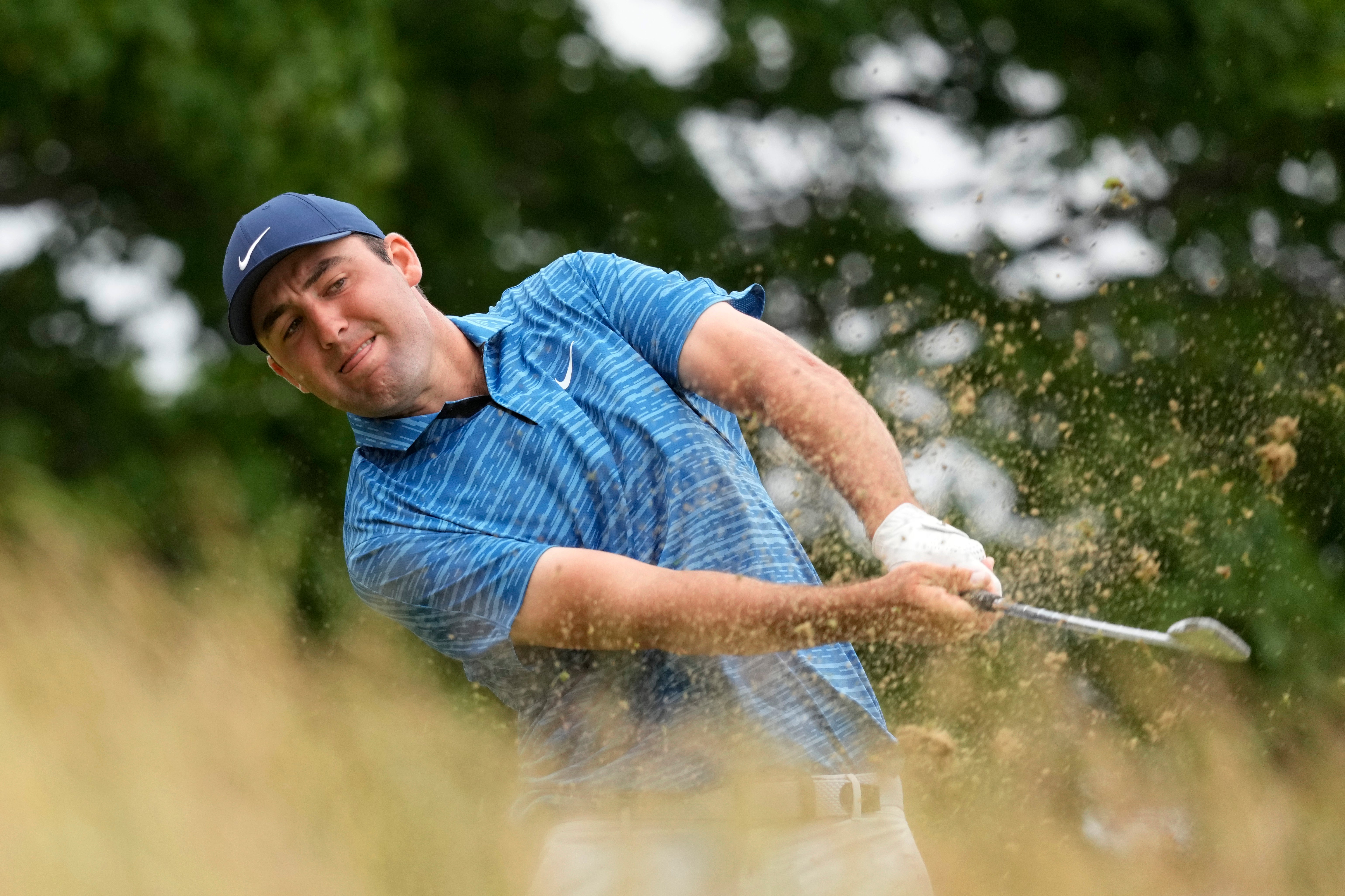 Scottie Scheffler claimed a share of the clubhouse lead on day two of the US Open (Charlie Riedel/AP)