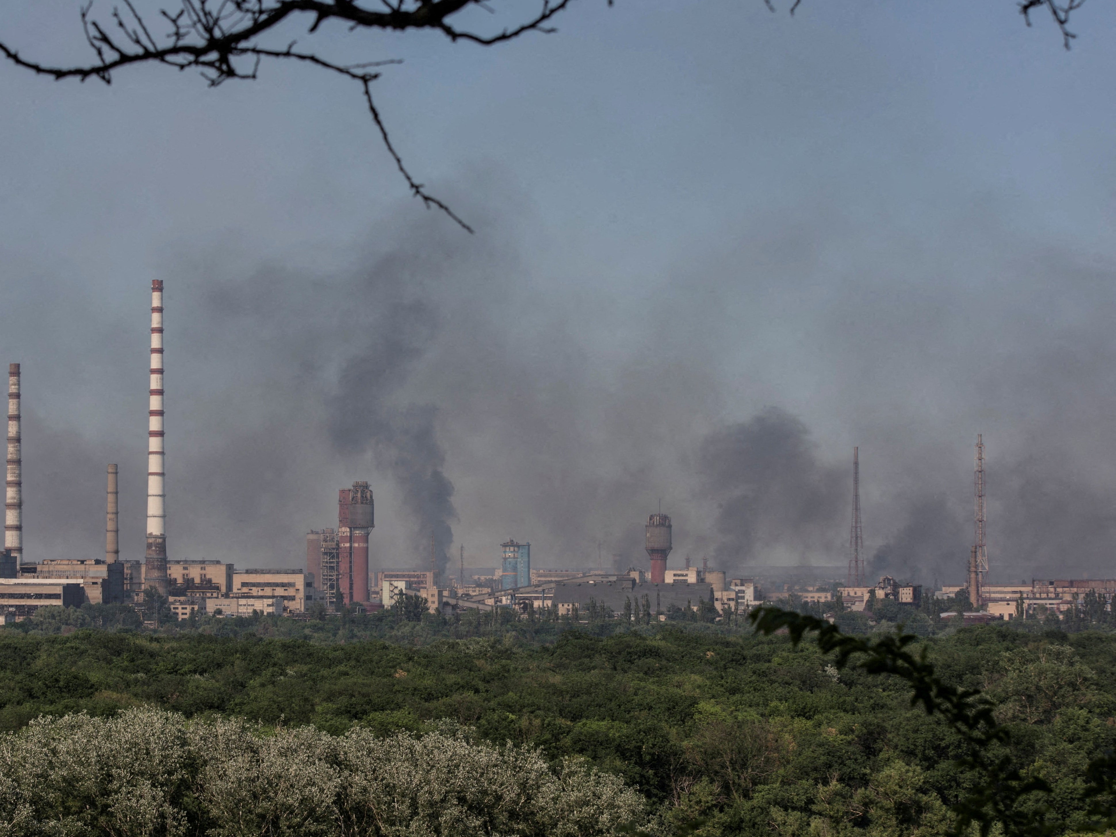 Smoke rises after a military strike on a compound of Sievierodonetsk’s Azot chemical plant, amid Russia’s attack on Ukraine, Lysychansk, Luhansk region on 10 June