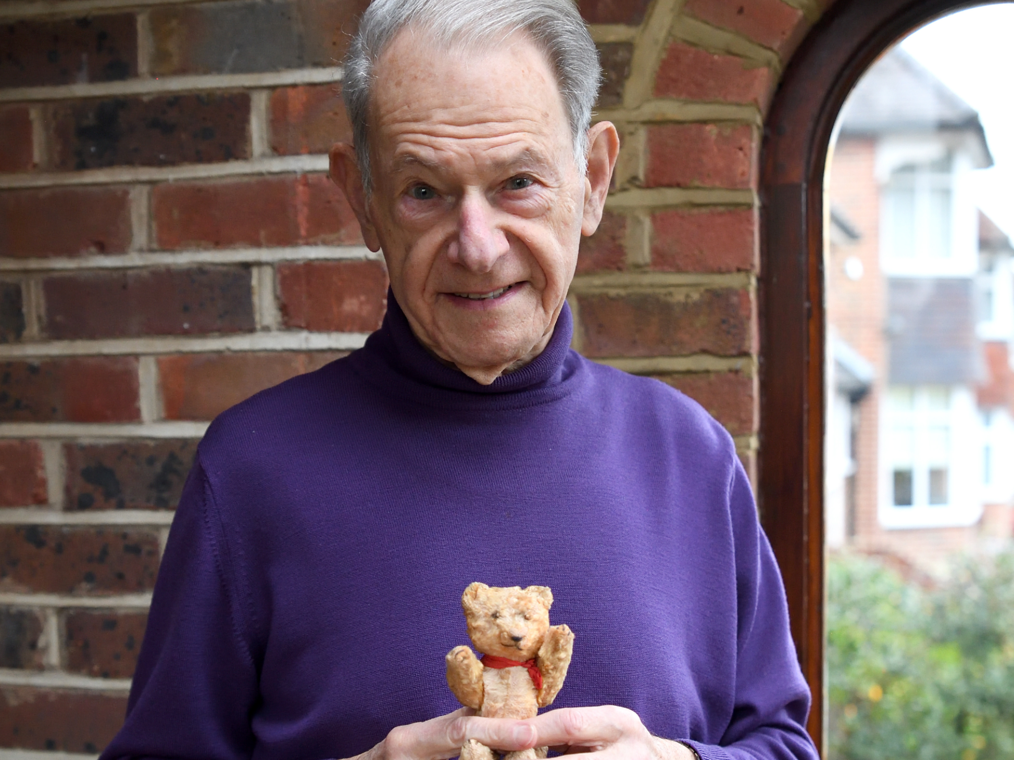 John Hajdu, 85, pictured with his teddy bear that he brought into the Budapest ghetto aged seven