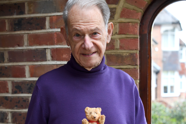 <p>John Hajdu, 85, pictured with his teddy bear that he brought into the Budapest ghetto aged seven </p>