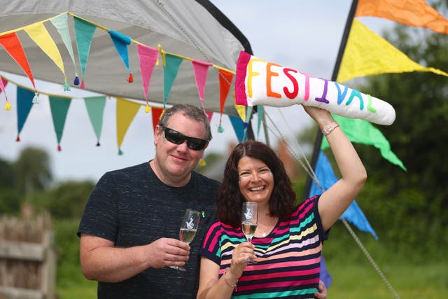 Stephen Webster and Arran Taylor won ?1m on Lotto in April 2021 and have been going to Glastonbury for more than 20 years (Martin Bennett/Camelot/PA)