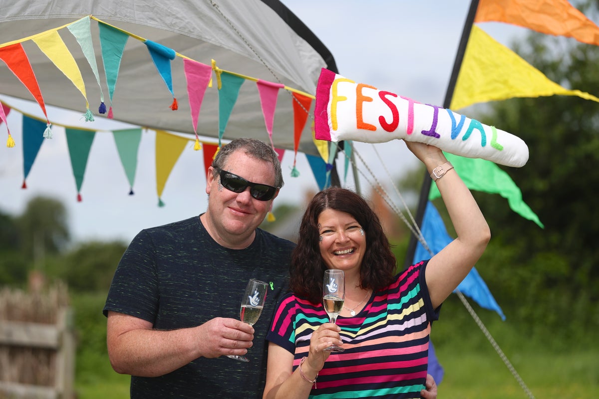 Family at Glastonbury for first time as lottery millionaires – in an old caravan