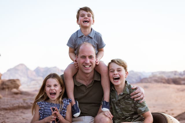 <p>Handout photo issued by Kensington Palace of the Duke of Cambridge with his children, Prince Louis, Prince George (right) and Princess Charlotte, to mark Father’s Day 2022</p>
