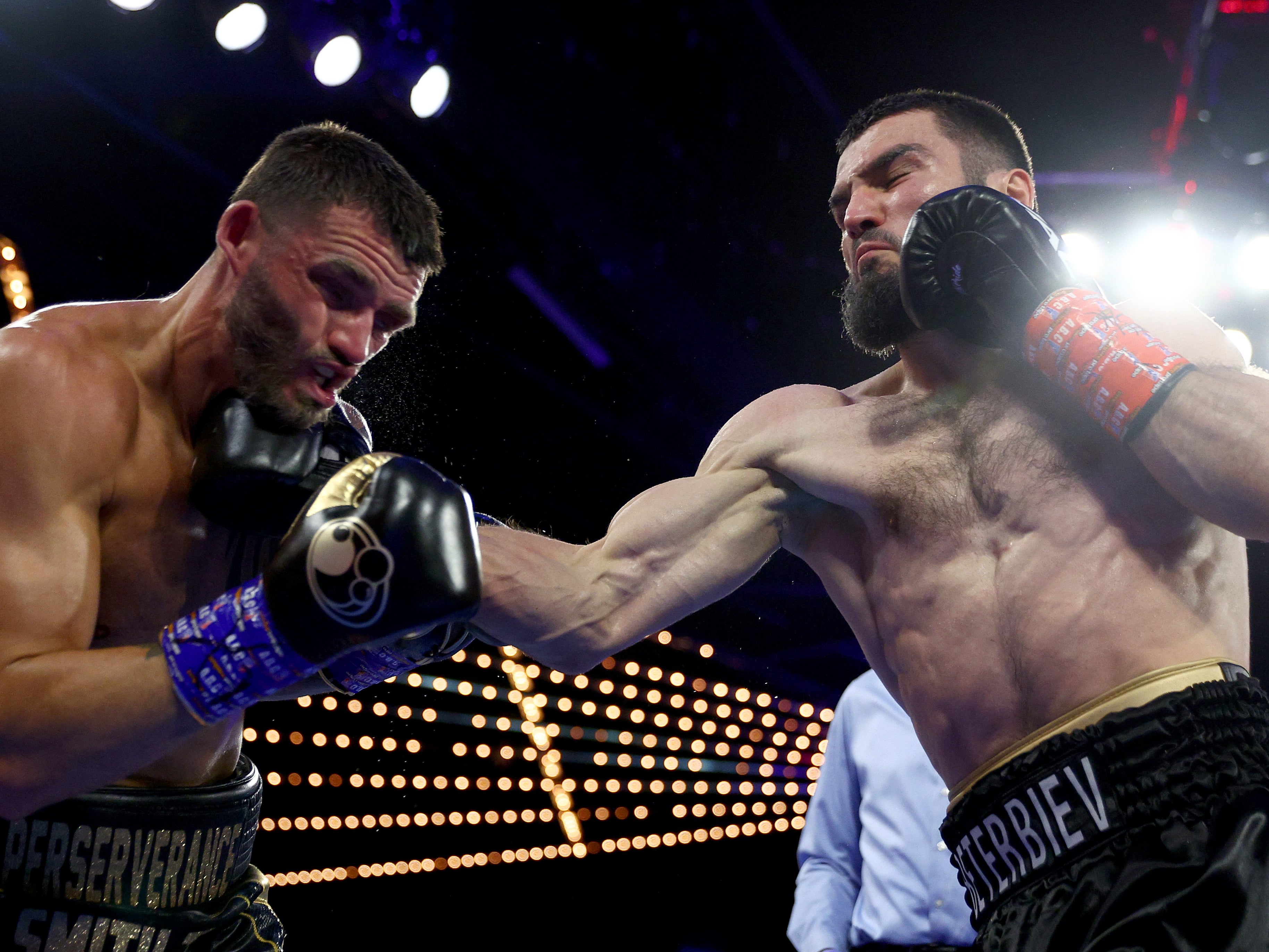 Artur Beterbiev (right) added the WBO belt to his WBC and IBF light-heavyweight titles