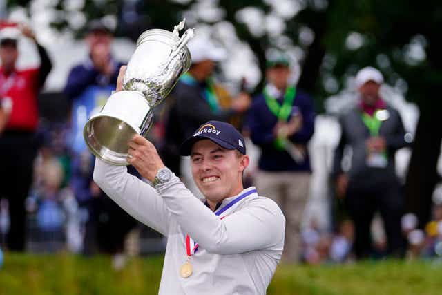Matt Fitzpatrick celebrates with the trophy after winning the 122nd US Open at Brookline (Julio Cortez/AP)