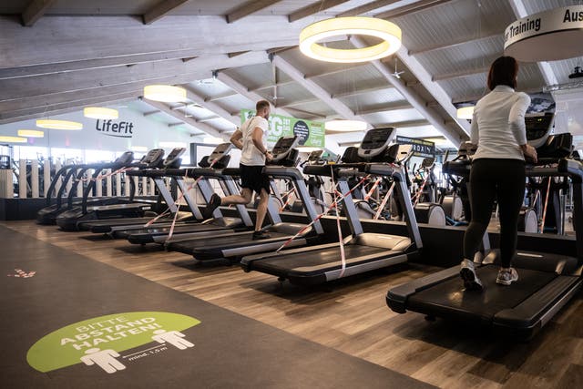 <p>Members run on a treadmill at Fitness gym LifeFit on May 11 in Dinslaken, Germany</p>