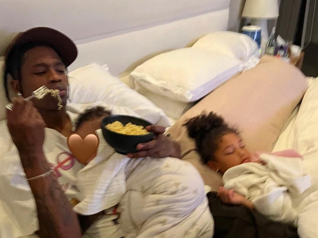Travis Scott with his baby son and four-year-old daughter, Stormi