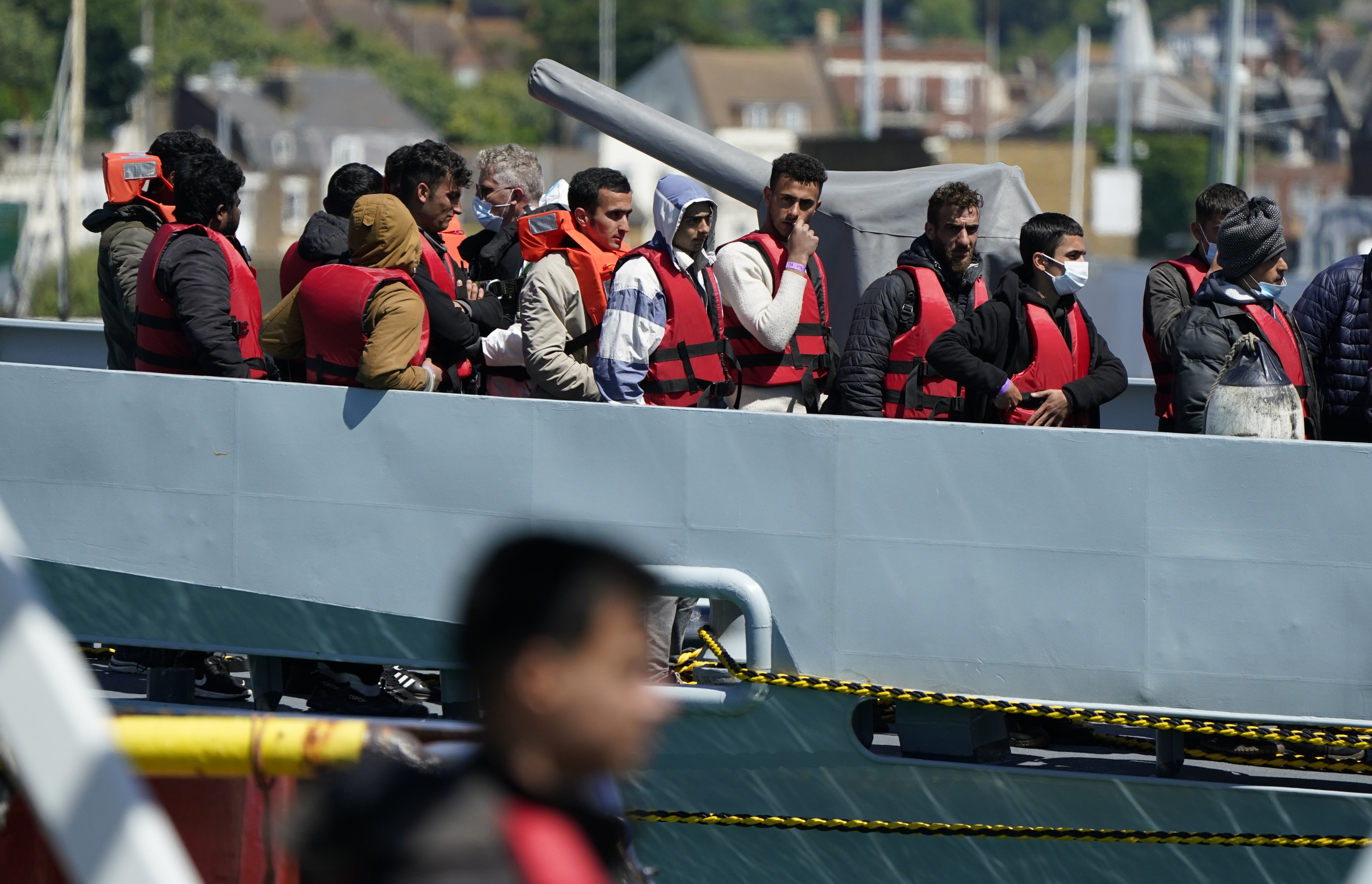 A group of people thought to be migrants are brought in to Dover (Andrew Matthews/PA)