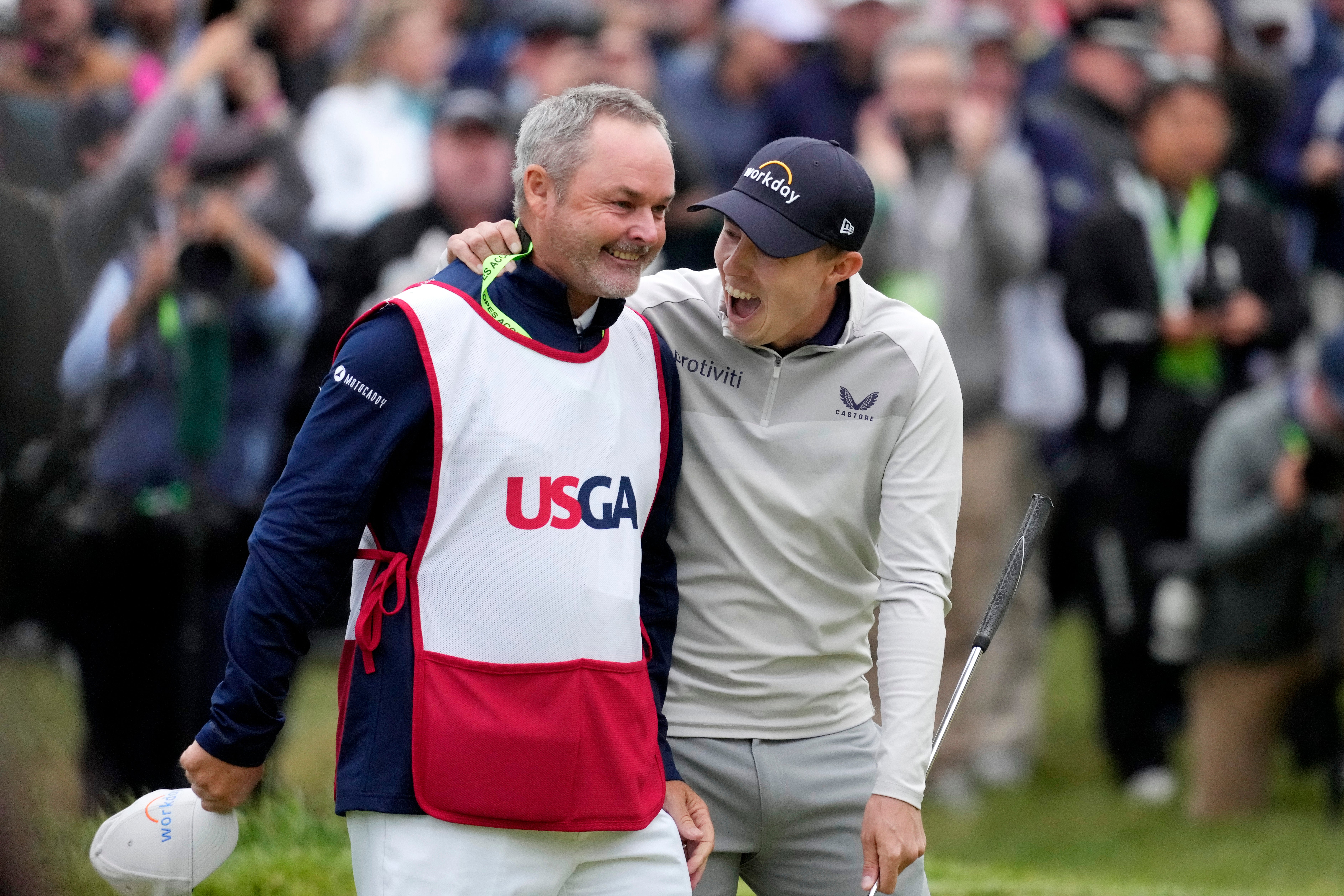 Matt Fitzpatrick celebrates with his caddie Billy Foster after winning the US Open at Brookline (Charlie Riedel/AP)