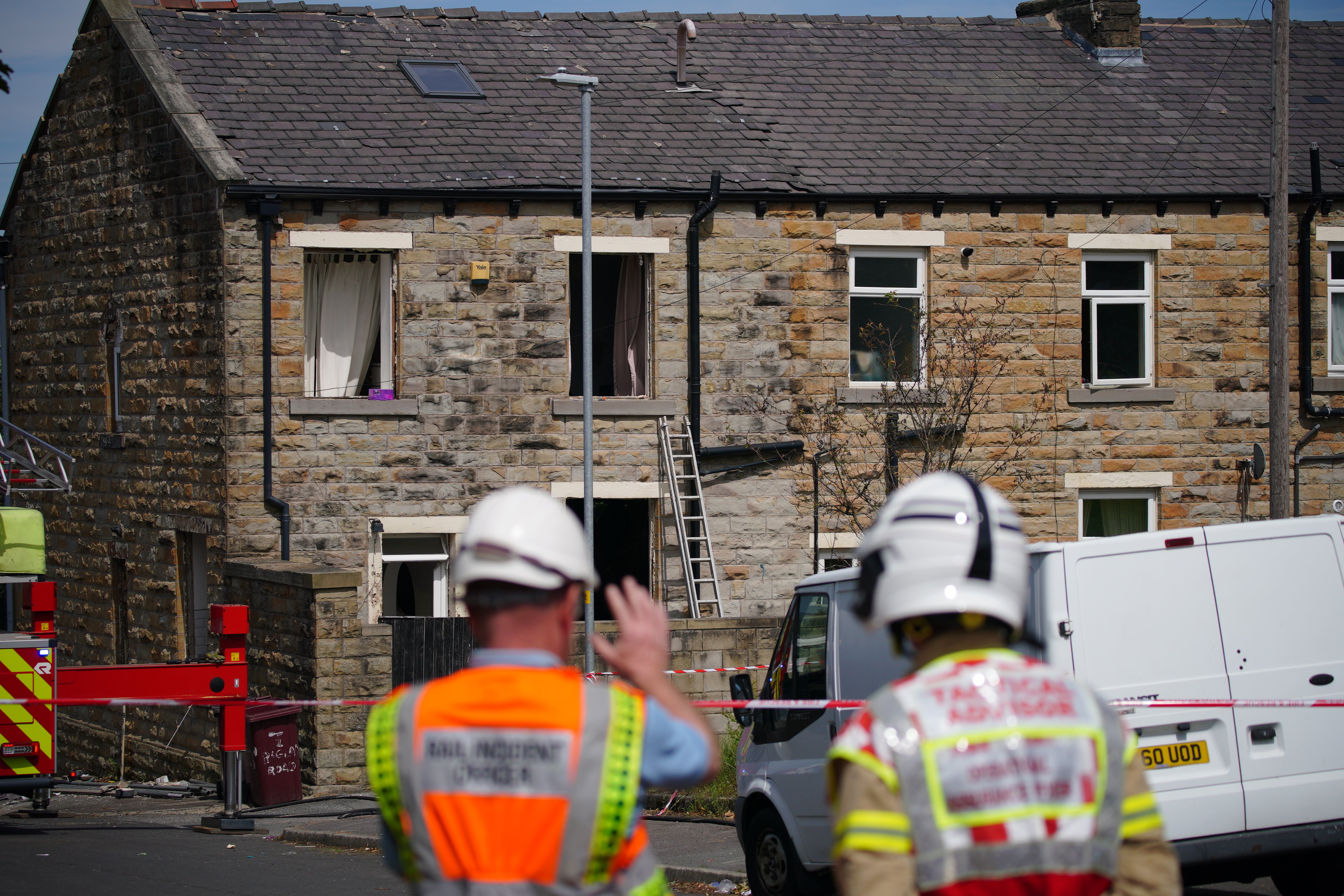 Emergency services at the scene following an explosion at a house in Burnley, Lancashire