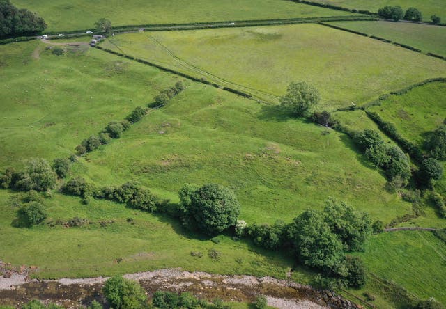 <p>An overhead view shows emergency services at the scene of a helicopter crash near Burton-in-Lonsdale</p>