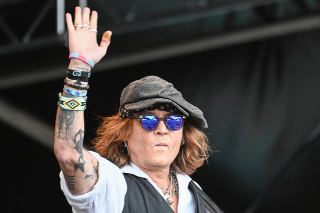 <p>US actor Johnny Depp performs on stage at the Helsinki Blues Festival, Finland, 19 June 2022</p>