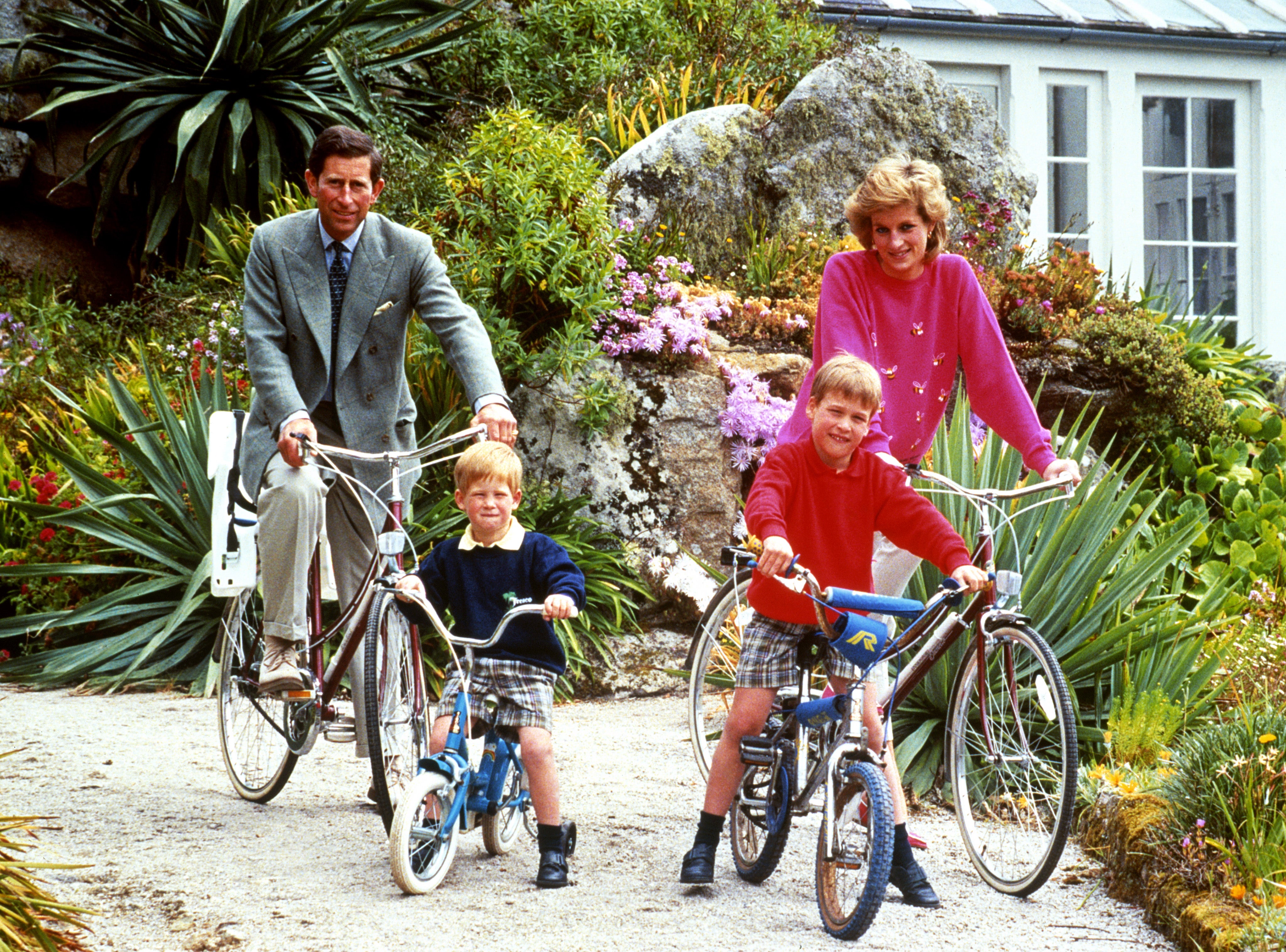 The Waleses prepare for a cycling trip in Tresco during their holiday in the Scilly Isles in 1989 (PA)