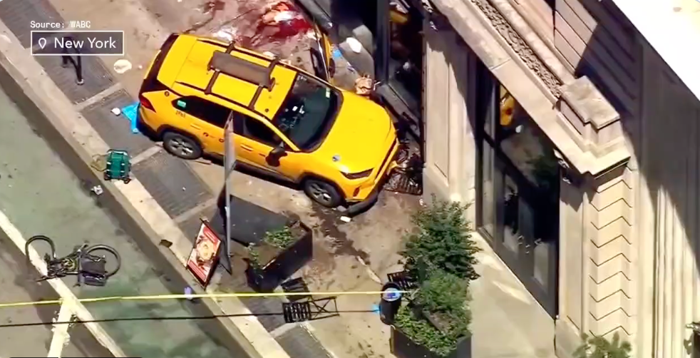 The taxi came to a halt after crashing into a building