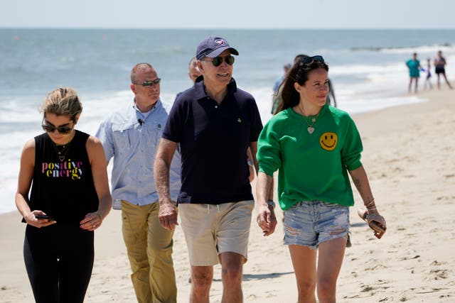 <p>President Joe Biden walks on the beach with his granddaughter Natalie Biden (left) and his daughter Ashley Biden (right) on Monday, 20 June 2022 at Rehoboth Beach, Delaware </p>