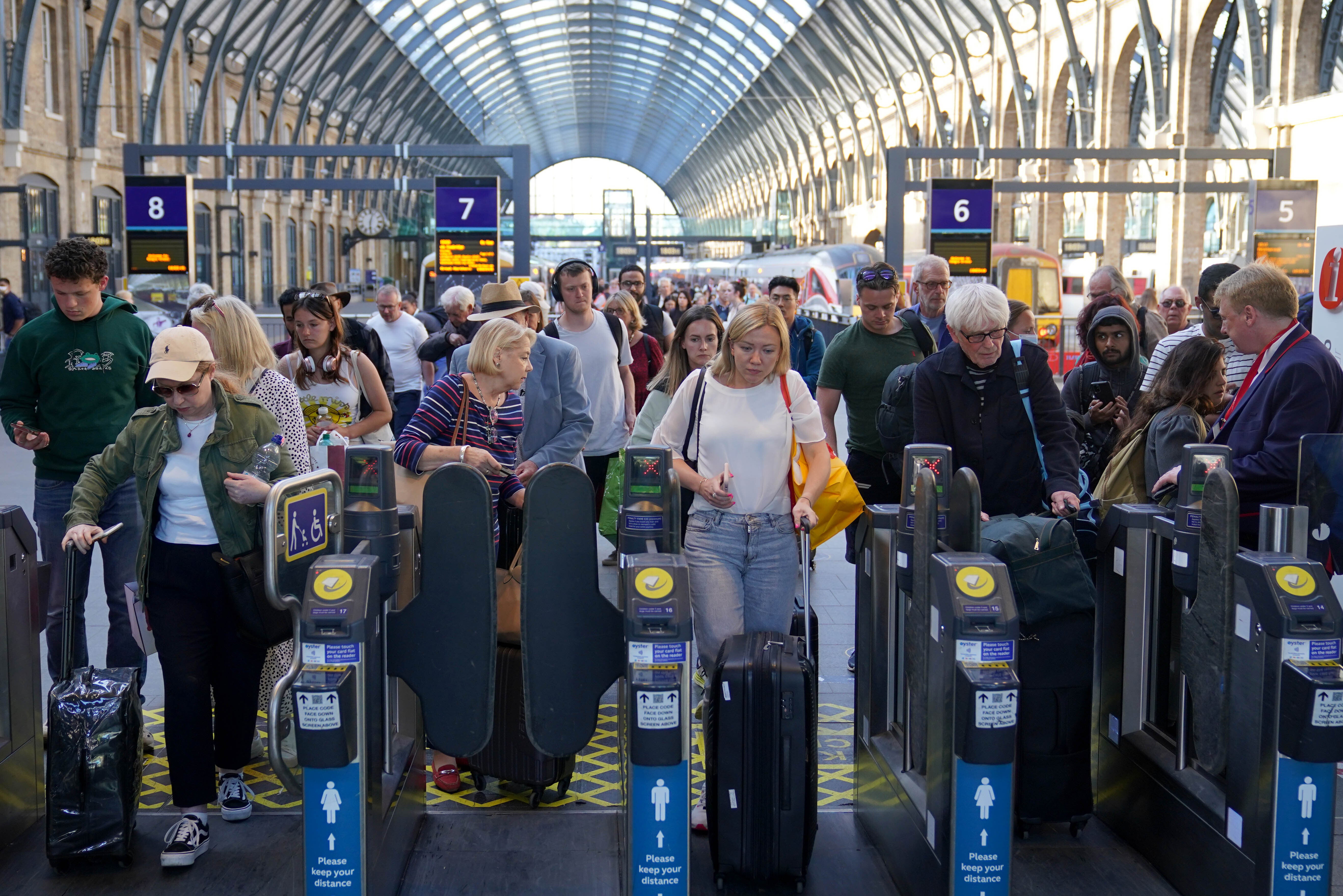 Passengers arrive at London King’s Cross station on Monday (Yui Mok/PA)